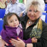 The Ms. Shirley Jones with a child at the shelter.